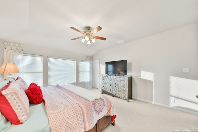 carpeted bedroom with ceiling fan and lofted ceiling