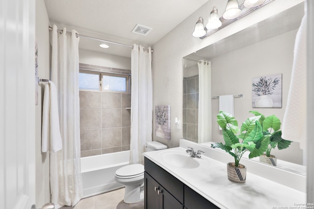 full bathroom featuring tile patterned flooring, vanity, toilet, and shower / tub combo