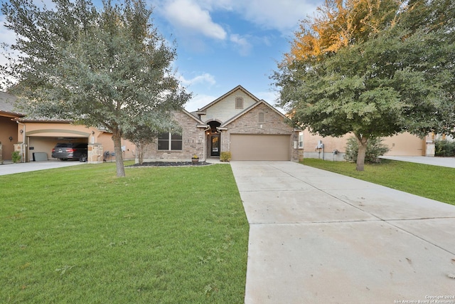 view of front of house featuring a front lawn and a garage