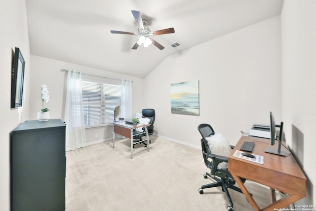 office space featuring ceiling fan, light colored carpet, and lofted ceiling