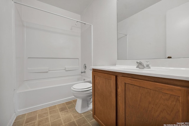 full bathroom featuring washtub / shower combination, vanity, and toilet