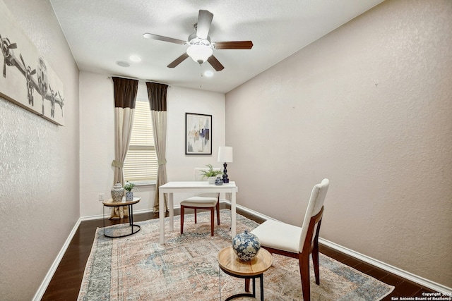 office area featuring ceiling fan and dark hardwood / wood-style floors