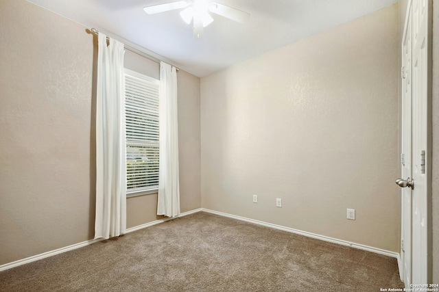 empty room with carpet and ceiling fan