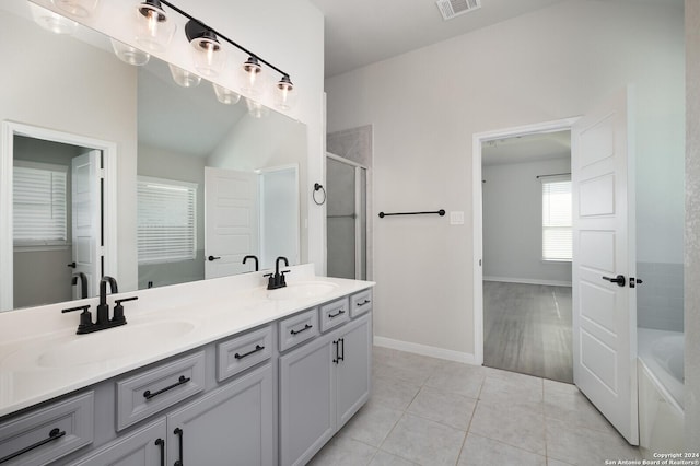 bathroom featuring tile patterned flooring, vanity, and independent shower and bath