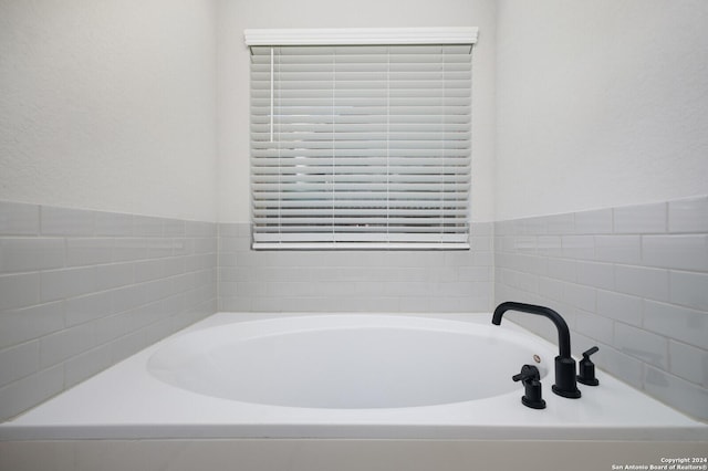 bathroom with a bathing tub