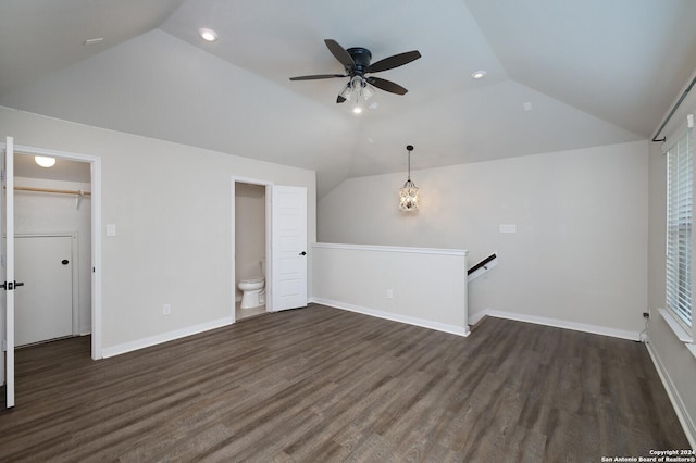 unfurnished living room featuring ceiling fan, dark hardwood / wood-style flooring, and lofted ceiling