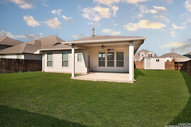 back of property featuring ceiling fan, a patio area, and a yard