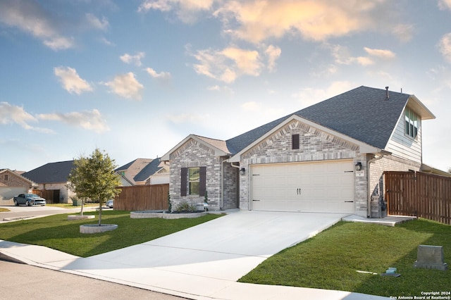 view of front of house with a front lawn and a garage