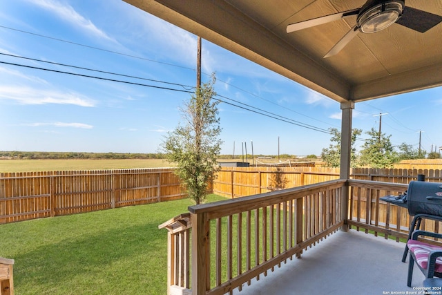 exterior space featuring a yard and ceiling fan