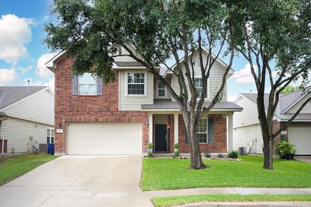 view of front of property featuring a front yard, central AC, and a garage