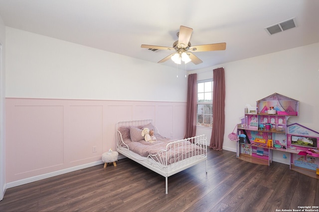 bedroom with ceiling fan and dark hardwood / wood-style flooring