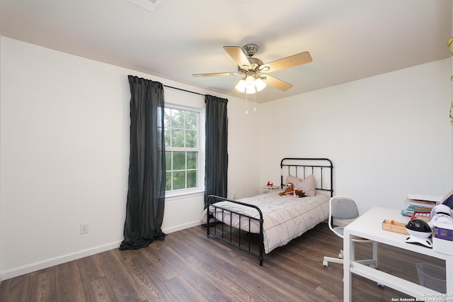 bedroom with ceiling fan and dark wood-type flooring