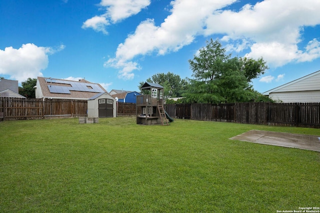 view of yard featuring a playground and a patio