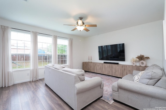 living room featuring hardwood / wood-style flooring and ceiling fan