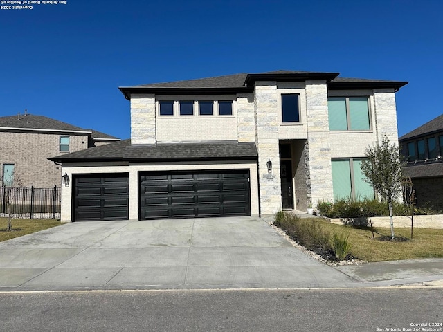 view of front of property with a garage