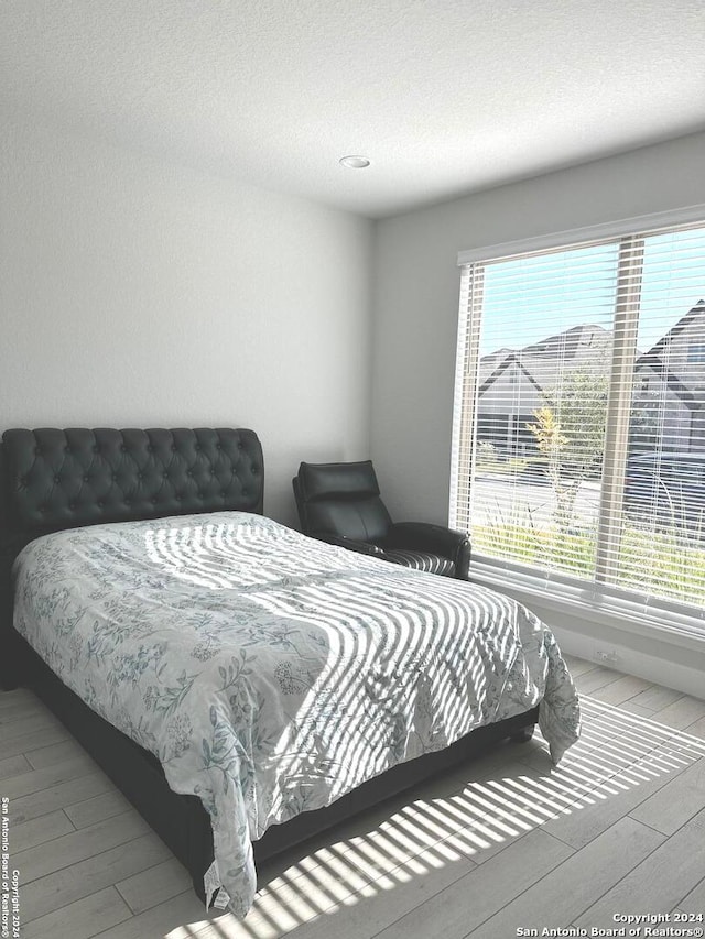 bedroom featuring hardwood / wood-style flooring