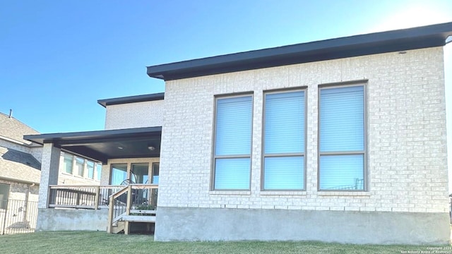 view of side of home with a porch