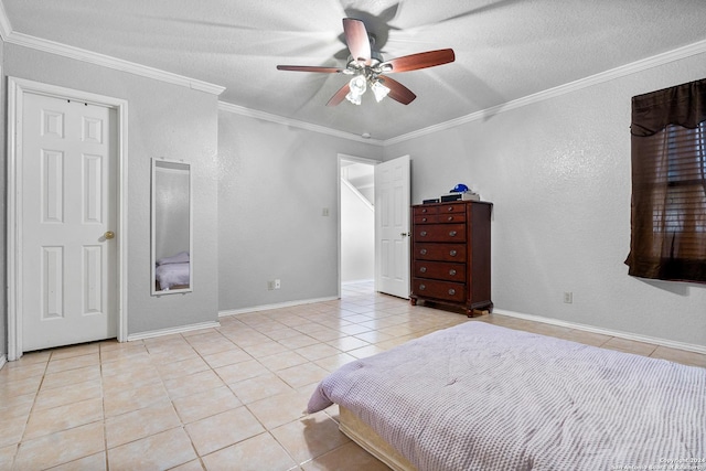 bedroom featuring a textured ceiling, ceiling fan, light tile patterned floors, and ornamental molding