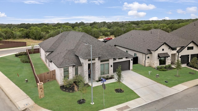 view of front of home with a front yard and a garage