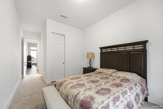 carpeted bedroom with a closet