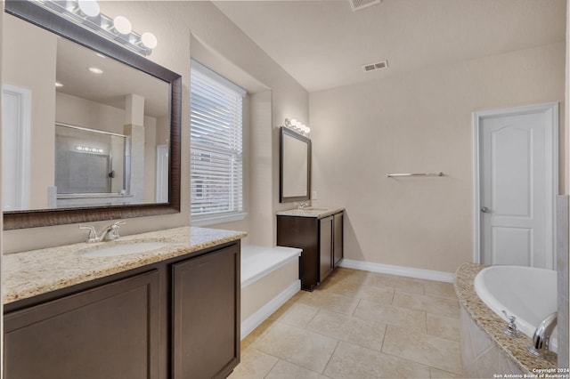 bathroom featuring tile patterned floors, vanity, and separate shower and tub