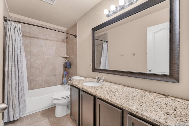 full bathroom with tile patterned floors, a textured ceiling, vanity, shower / bathtub combination with curtain, and toilet