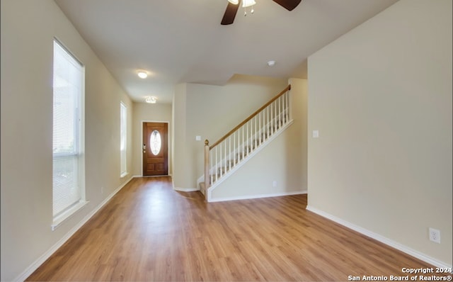 foyer featuring ceiling fan and light hardwood / wood-style flooring