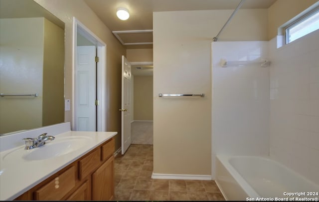 bathroom featuring vanity and bathing tub / shower combination