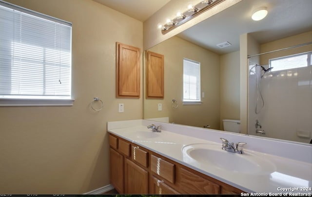 full bathroom featuring vanity, toilet, and shower / bathtub combination