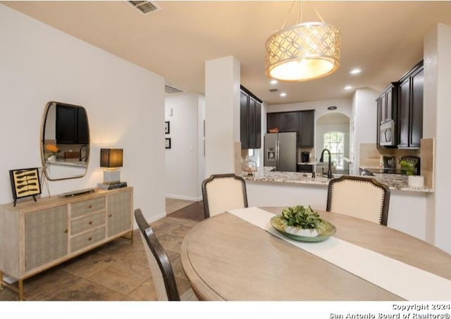 dining room featuring sink