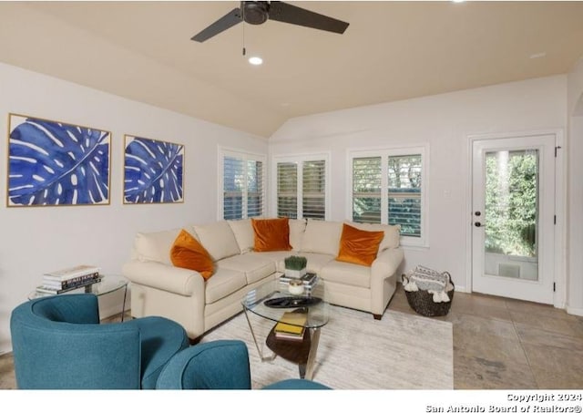 tiled living room with vaulted ceiling and ceiling fan