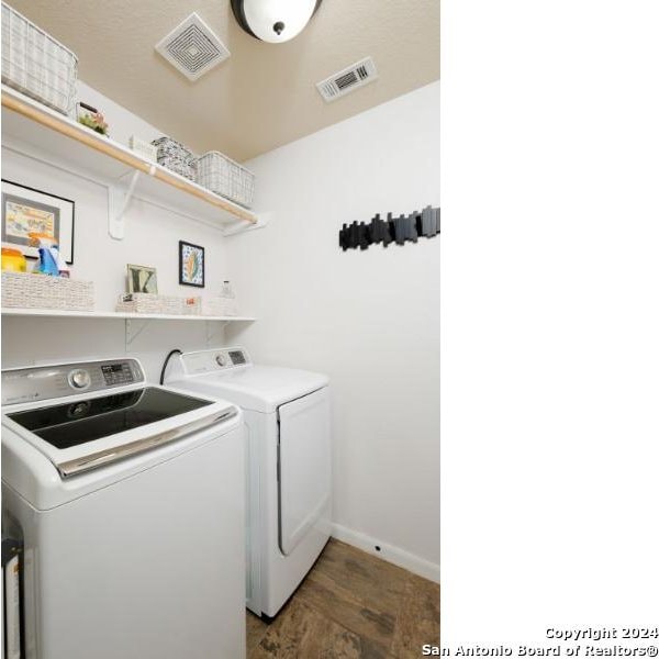 clothes washing area featuring washing machine and clothes dryer