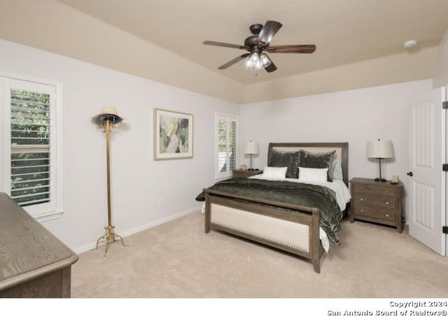 bedroom featuring ceiling fan and light colored carpet