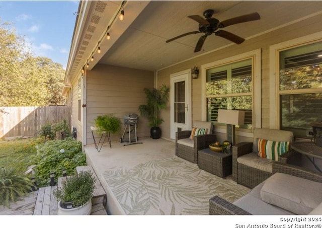 view of patio with an outdoor hangout area and ceiling fan