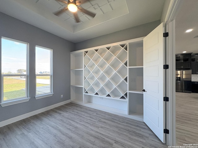 unfurnished room featuring ceiling fan and light hardwood / wood-style flooring