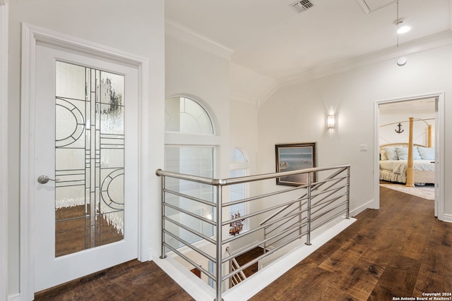 hallway featuring dark hardwood / wood-style floors and crown molding