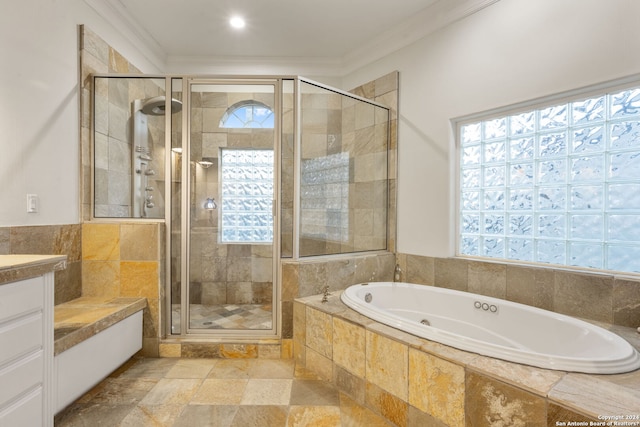 bathroom with separate shower and tub, vanity, and ornamental molding