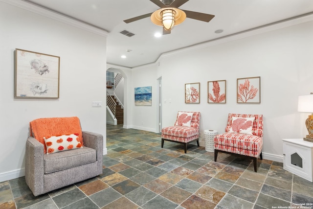 sitting room featuring ceiling fan and crown molding