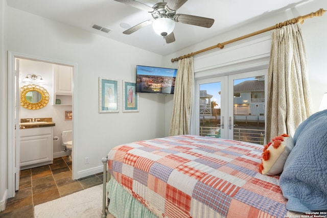 bedroom featuring access to exterior, french doors, ensuite bathroom, and ceiling fan