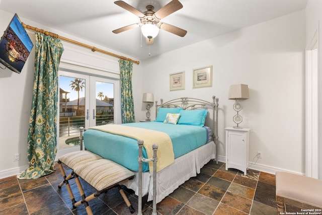 bedroom featuring ceiling fan and french doors