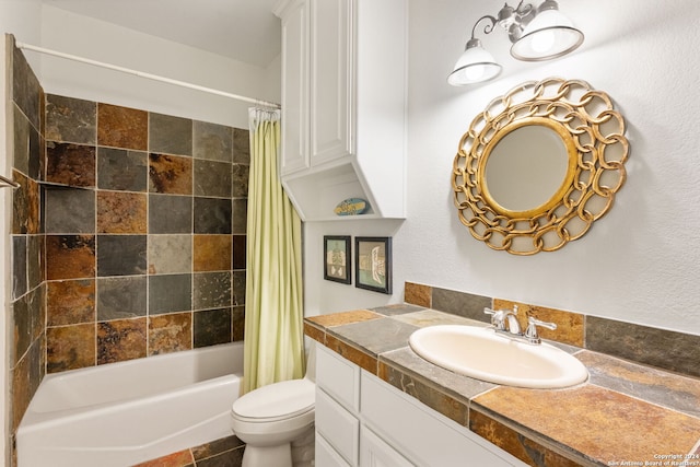 full bathroom featuring vanity, shower / bath combination with curtain, and toilet