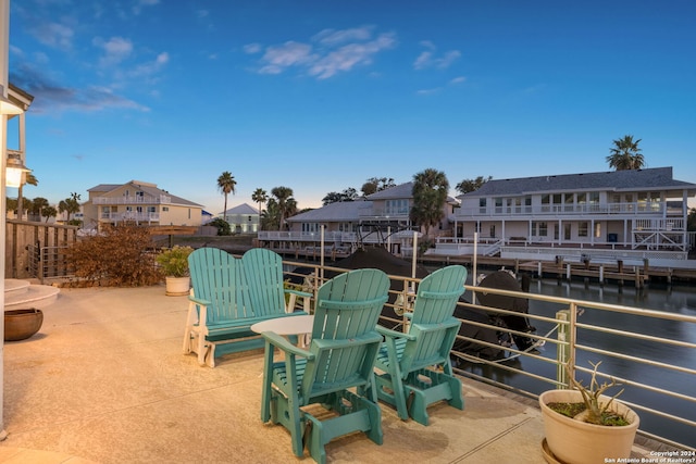 view of patio with a water view