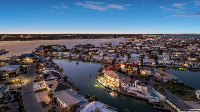 aerial view at dusk with a water view