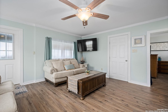 living room with hardwood / wood-style floors, ornamental molding, a healthy amount of sunlight, and ceiling fan