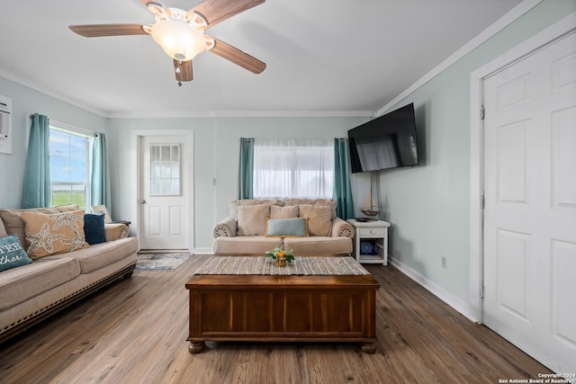 living room with ceiling fan, dark hardwood / wood-style flooring, and ornamental molding