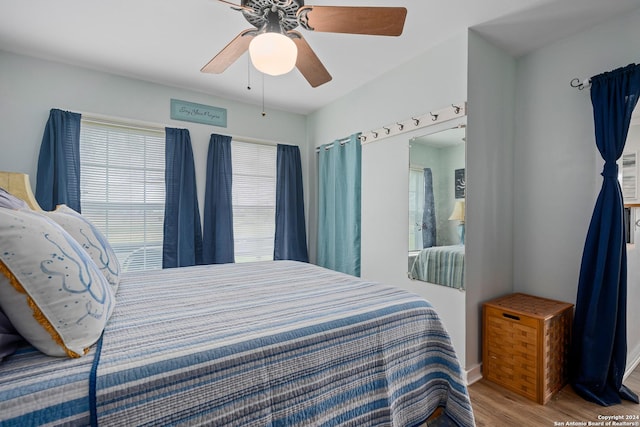 bedroom featuring ceiling fan and light hardwood / wood-style flooring