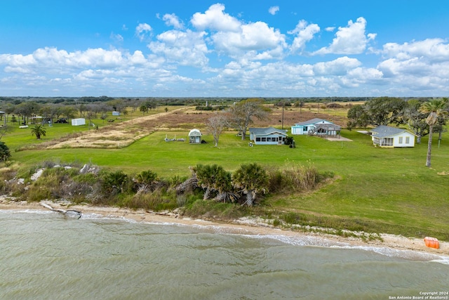 drone / aerial view featuring a rural view and a water view
