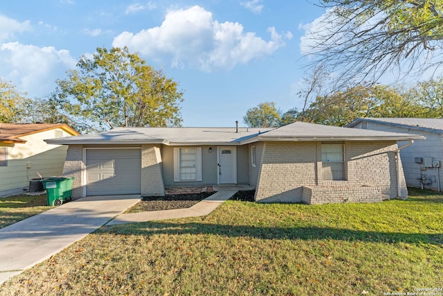 ranch-style home featuring a front yard and a garage