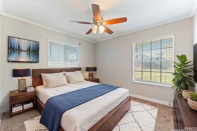 bedroom with multiple windows, ceiling fan, and ornamental molding