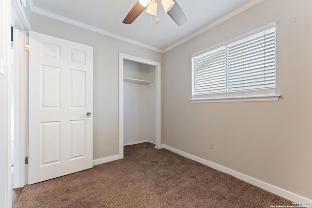 unfurnished bedroom with carpet flooring, ceiling fan, a closet, and ornamental molding